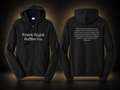 "Be The One" - Black Edition Zip-Up in Jet Black, front and back views, black background with warm beige glow